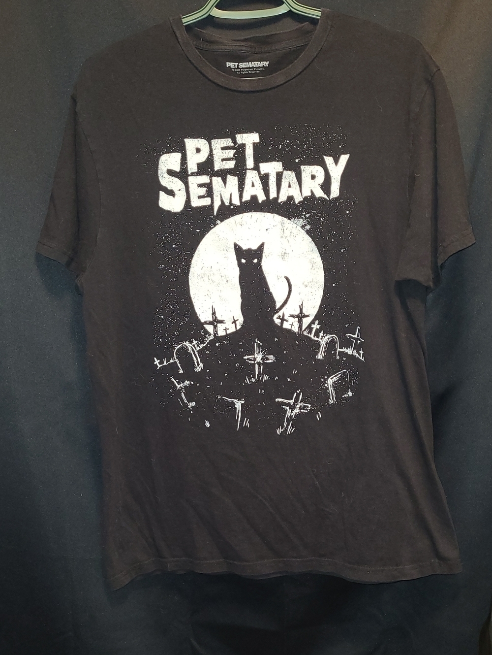 Pet Sematary t-shirt featuring a graphic of a cat silhouette in front. 2018